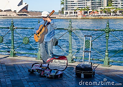 Aki Miyoshi, Japanese world guitarist ranking 6th on street performing at Sydney Circular Quay. Editorial Stock Photo